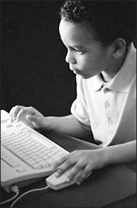 Photograph of child and computer.