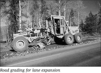 Photograph -- Road grading for lane expansion.